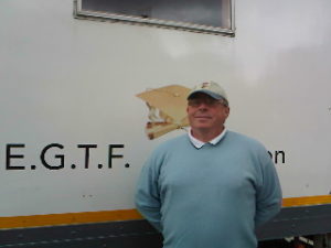 John Dunphy in front of lorry