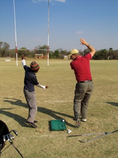 Living Golf SA teaching township child 